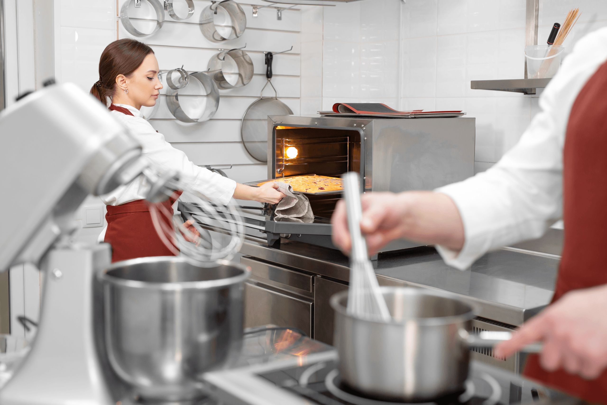 0female pastry chef puts the sponge dough in the ov 2026 01 07 05 41 35 utc